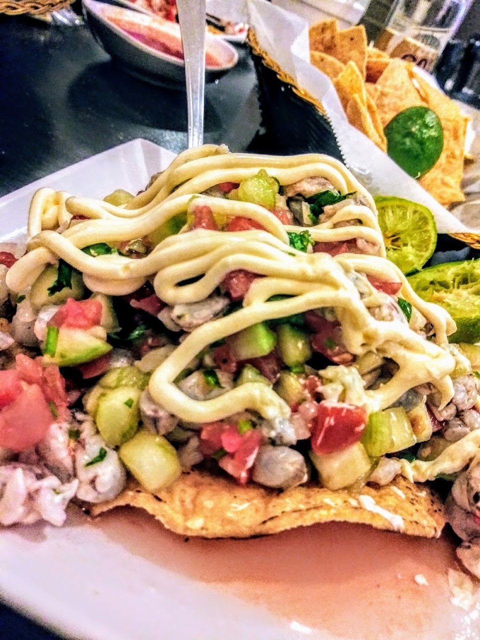 Seafood menu with cocktails and tostadas.