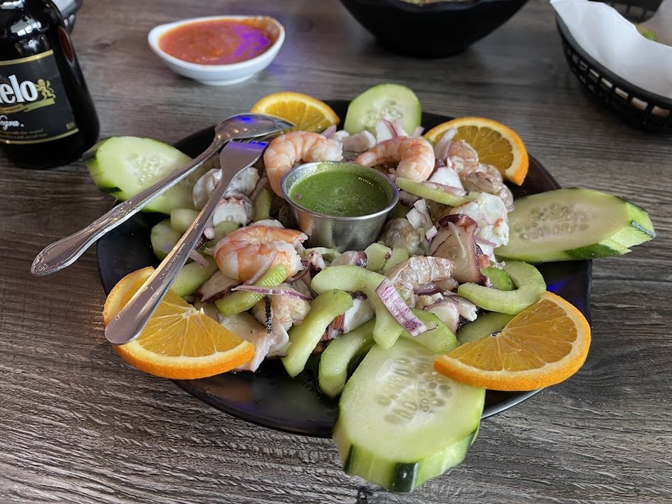 Menu page with seafood sections and photos.