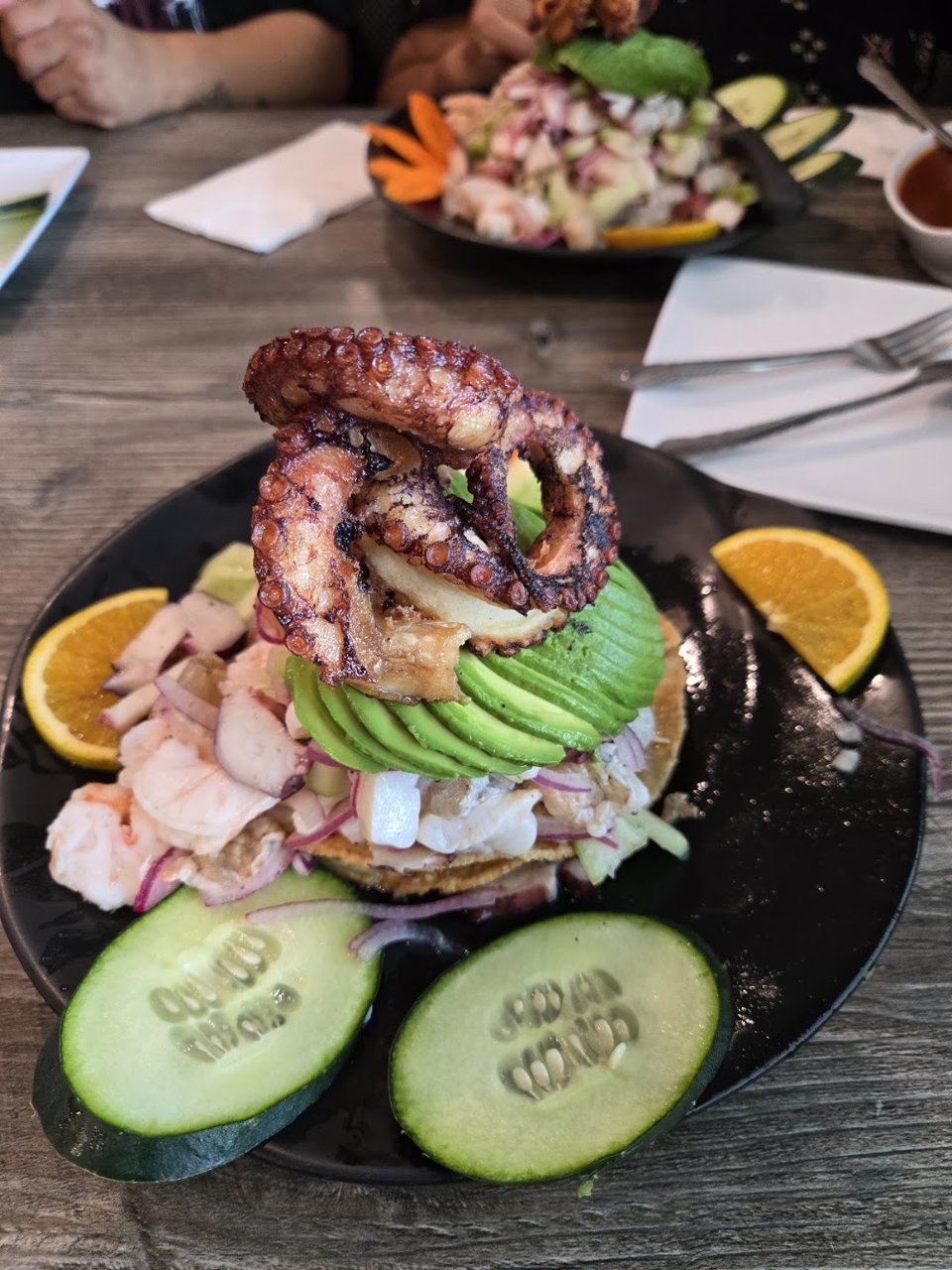 Menu page with seafood sections and photos.